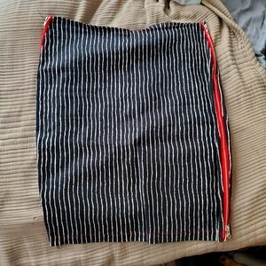 Switchblade stiletto black and white pencil skirt with red working side zippers.